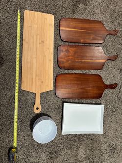 Assorted serving dishes, charcuterie boards, and bowls