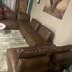 Couch $100 need it gone. Porforated leather.