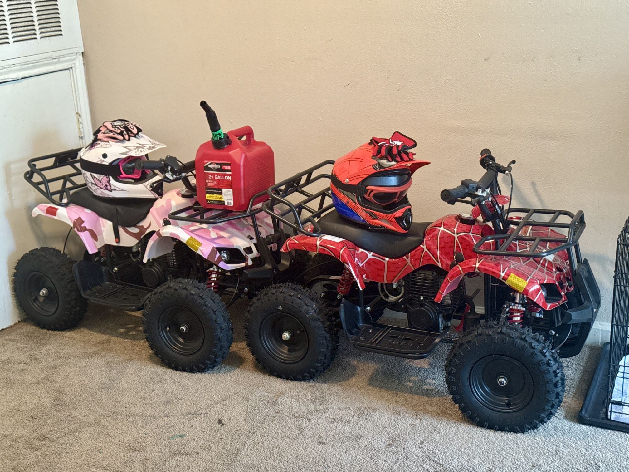 Kids motorized ATV w/helmets, goggles, gloves, fuel, and gas can