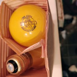 A Pack Of 100 Watt Yellow Bulbs