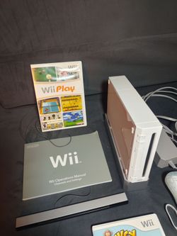 Nintendo Wii gaming console with 12 games