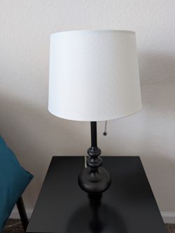 Corded black lamp with white lamp shade