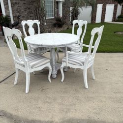 Gorgeous Wood Distressed Table w/ 4 Chairs newly upholstered. 40” round 30” height.