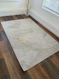 Beige Area Rug with Abstract Wave Pattern