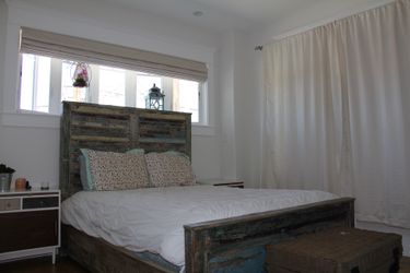 Queen bed with aged wood from boats