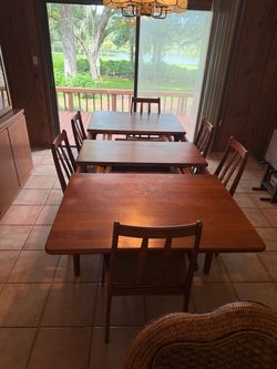 Solid teak dining table with extension