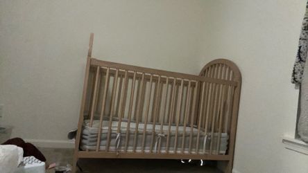 Wood framed toddler crib