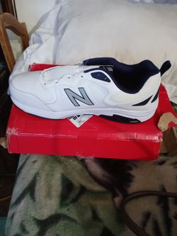 A pair of new balance shoes size 18for men