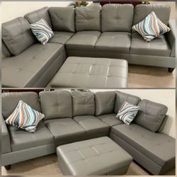 Brand New Grey Leather Sectional With Storage Ottoman 