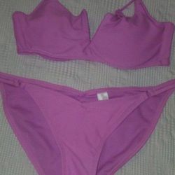 Two Piece Pink Women's Bathing Suit- Pushup Top is a  Small and the Bottom is S/Med.