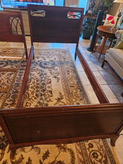 Antique cherry twin bed.