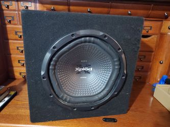 1200 watt Sony Xplod 12-inch car subwoofer enclosed in a carpeted speaker box,