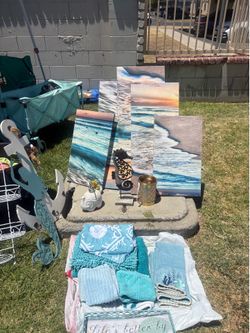 Beach theme decor & shower curtain, towels, wax warmer, mermaid wall decor, wooden anchor for hanging towels etc..
