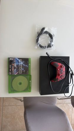 Used Xbox One X with controller and 2 games