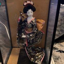 Vintage geisha doll is a traditional Japanese doll.
