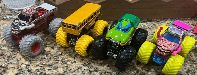 4 monster trucks