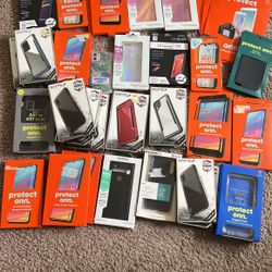 Bunch Of Screen Protectors And Cases 