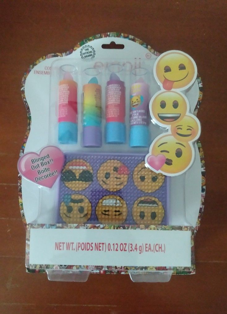 BRAND NEW IN PACKAGE EMOJI ICONIC FLAVORED LIP BALM WITH PURPLE EMOJI ICONIC BLINGED OUT MAKE-UP CASE - AGES 8+