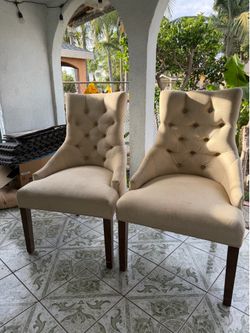 Two beige chairs