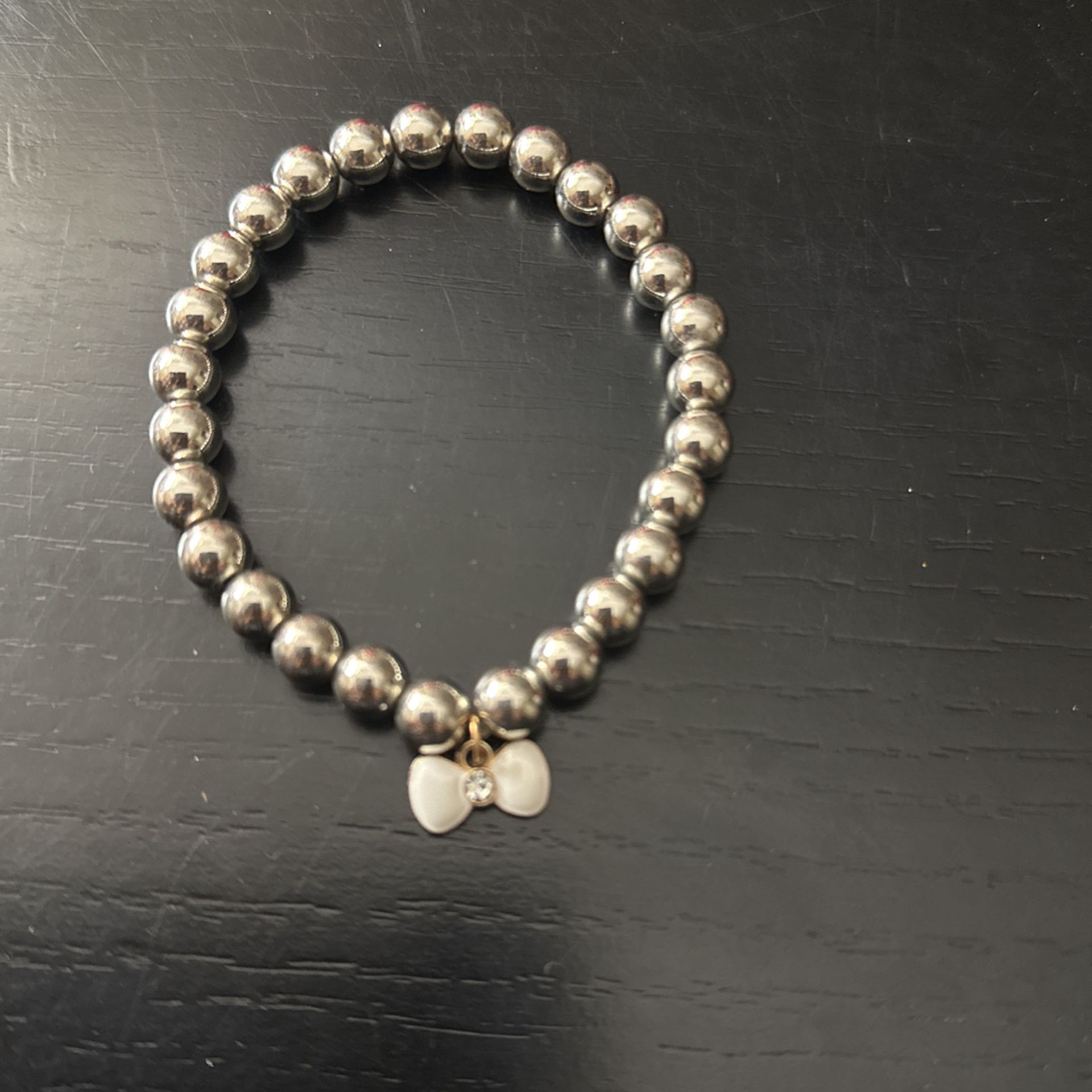 Silver Bead Bracelet With A White Charm