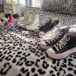 4 pairs of converse shoes