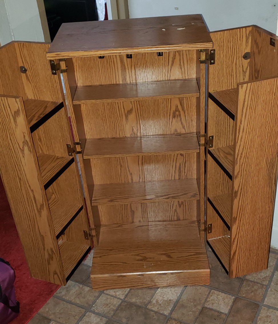 Small storage cabinet with shelves