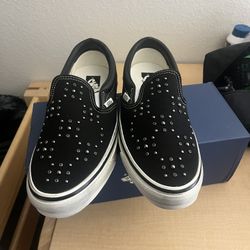 black pearlized slip on vans 
