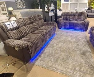 Brown 2 piece reclining sofa and loveseat set