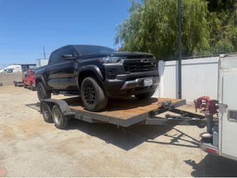 16 ft long by  7 ft wide  inches  is 195 long by 83 wide  inside fenders