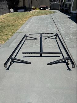 Black metal bed frame can adjust to queen/full