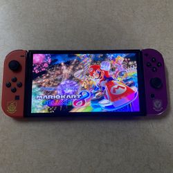 NINTENDO SWITCH OLED POKEMON EDITION with 125 SWITCH GAMES INSTALLED