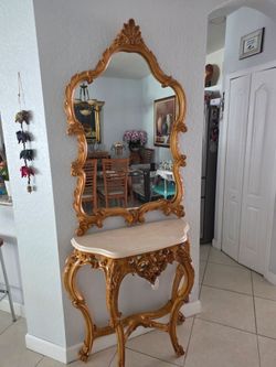 Vintage gold carved console table with mirror”