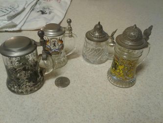 Antique collectible miniature beer steins made in Germany pewter and silver tops