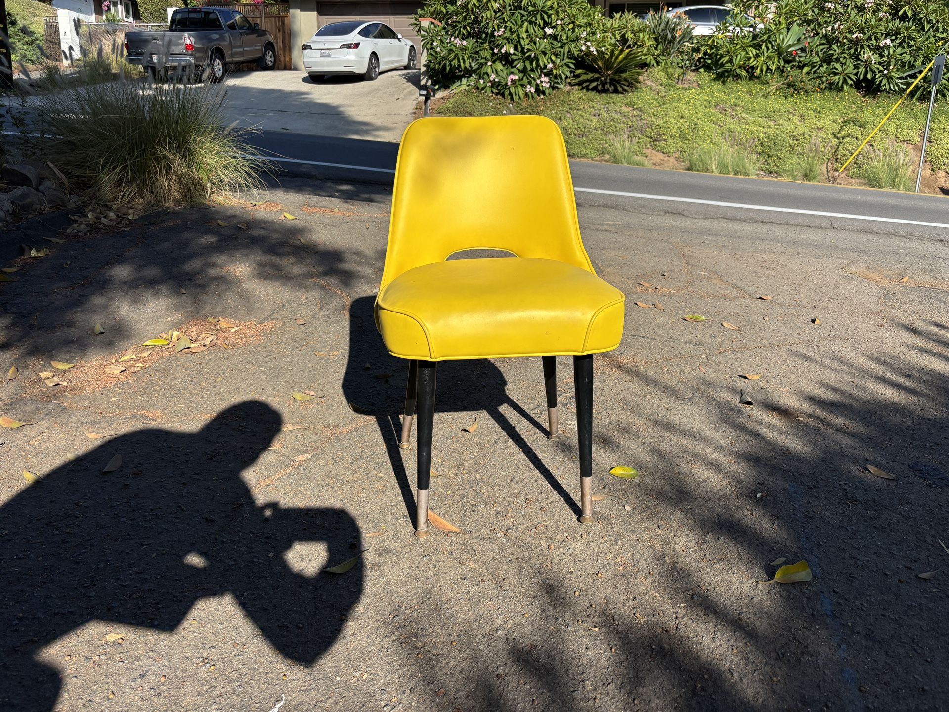 Bright yellow mid-century style chair