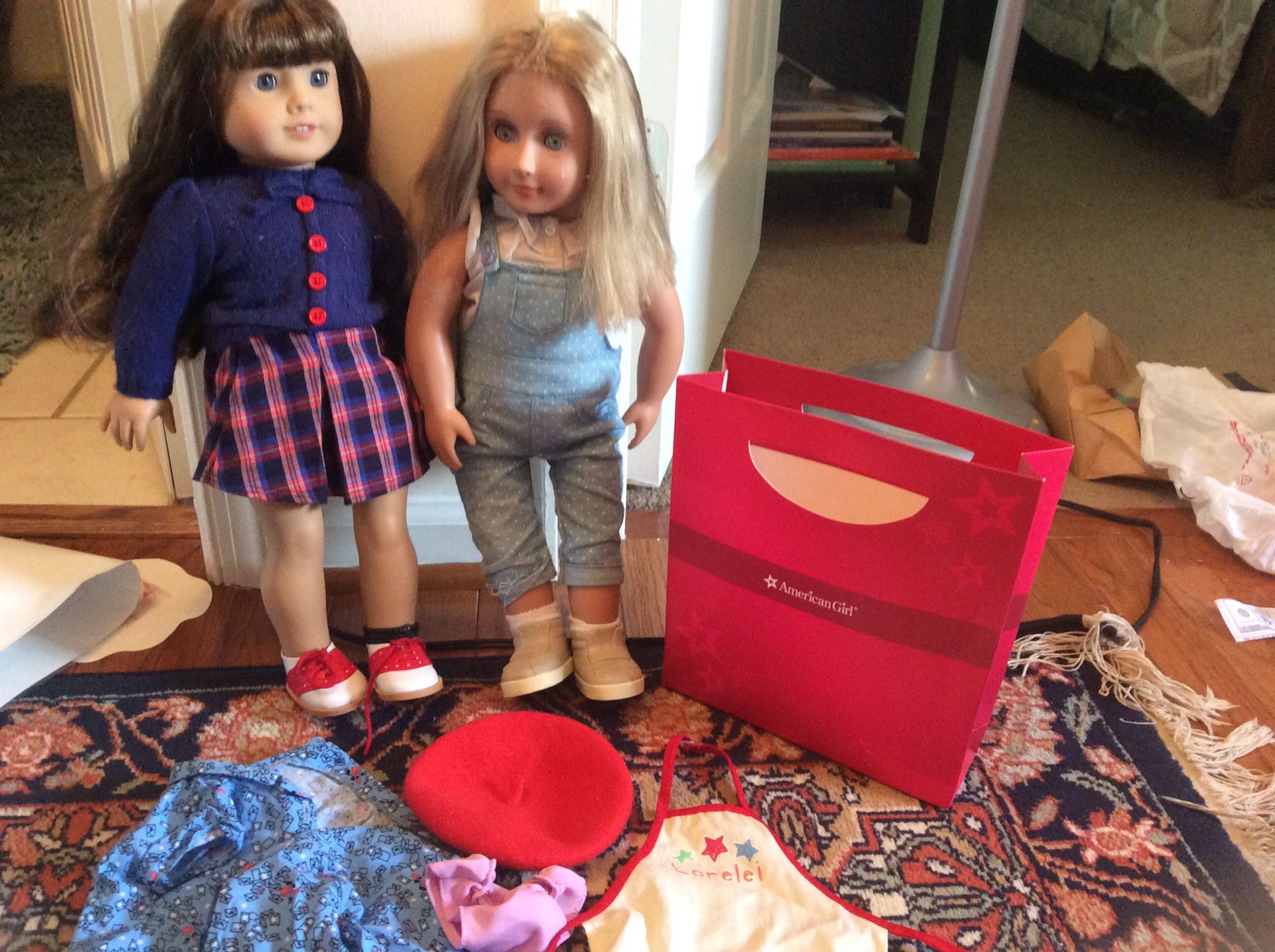 One generation doll and one American girl doll. Some accessories.