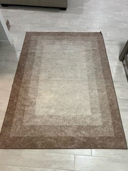 Brown Bordered Area Rug