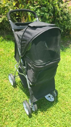 Pet stroller like new with cup holder, storage basket