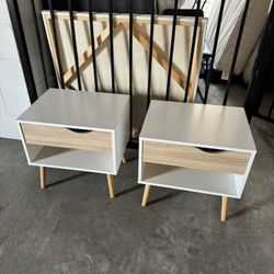 2 white nightstands Tables available