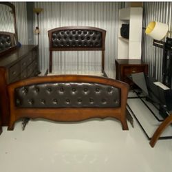 Cherry Wood and Leather Headboard/Foot board with Slats. Matching Dresser and Mirror. 2 Matching Nightstands. Glass Top TV Stand. @ Standing Lamps
