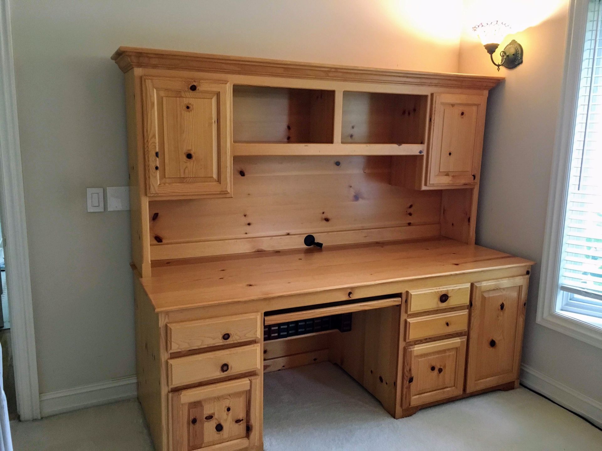 Custom desk with bookshelves and cabinets.