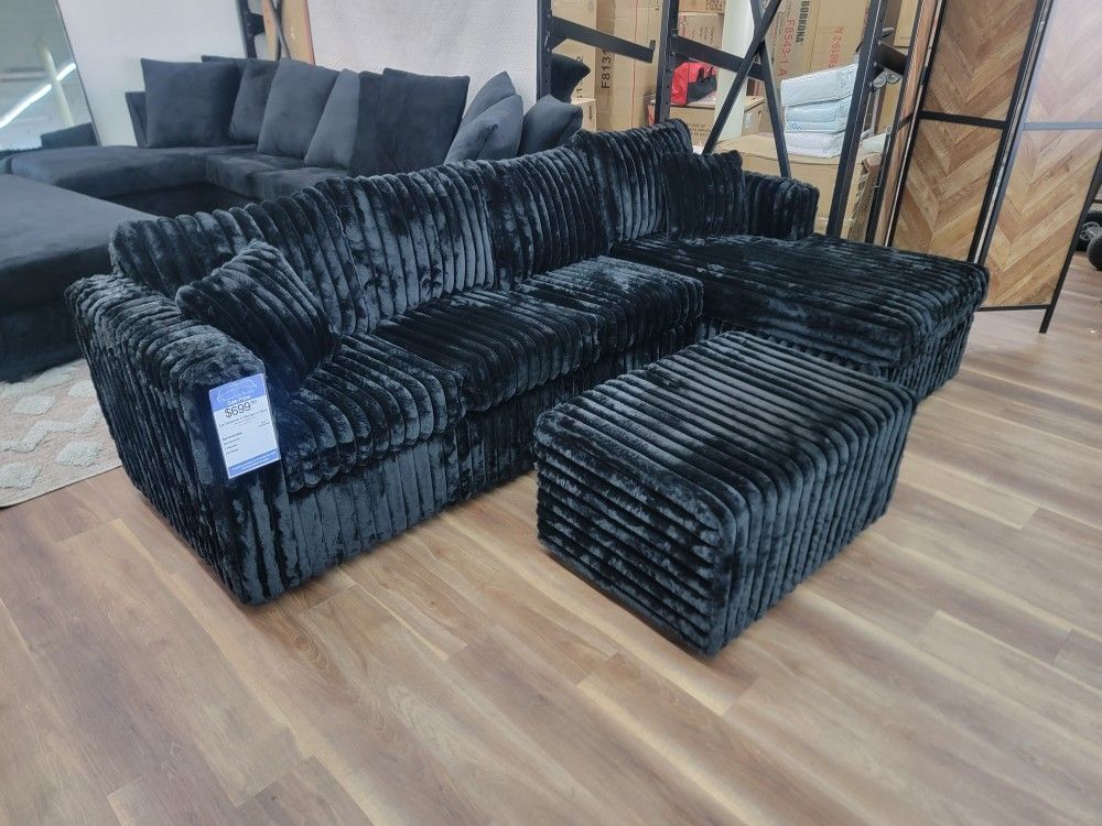 New 2pc Sectional Plus Ottoman In Black