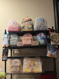 Our loungefly princess bags!!