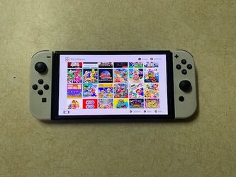 NINTENDO SWITCH OLED + 7500 GAMES