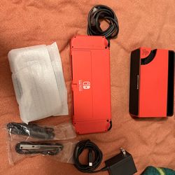Red Nintendo Switch OLED, all accessories included, used very little, Luigi game included