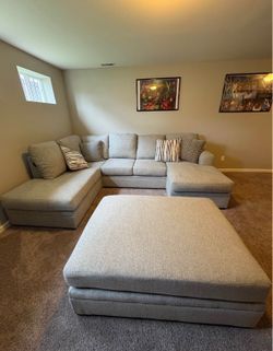 Ashly's Sectional with ottoman and pillows
