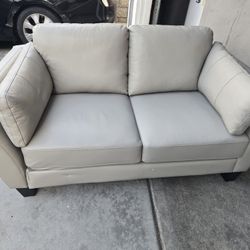 BRAND NEW LEATHER LOVE SEAT  $200