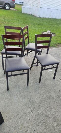 Folding chairs with leather upholstered seats