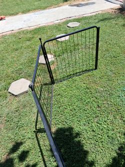 Black metal fence 15 1/2 ft long by 2 feet tall with a little swinging door for garden or home dogs or kids makes any shape you want