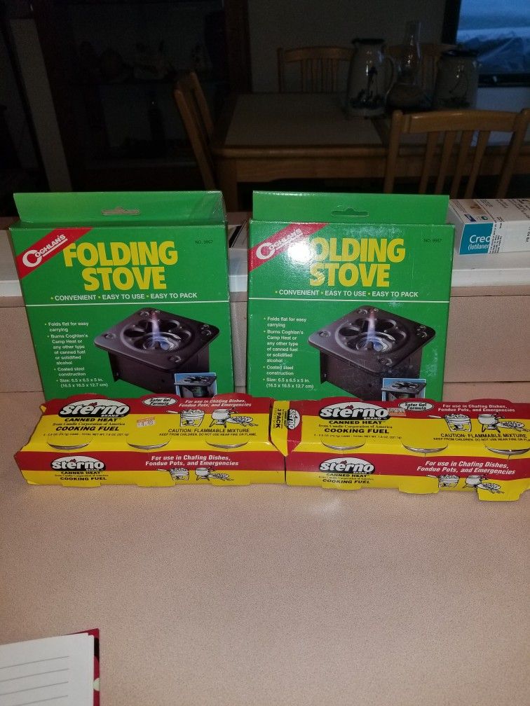 2 NEW COGHLANS FOLDING STOVES AND STERNO. PICK UP MIDDLEBORO ONLY FINAL SALE.
