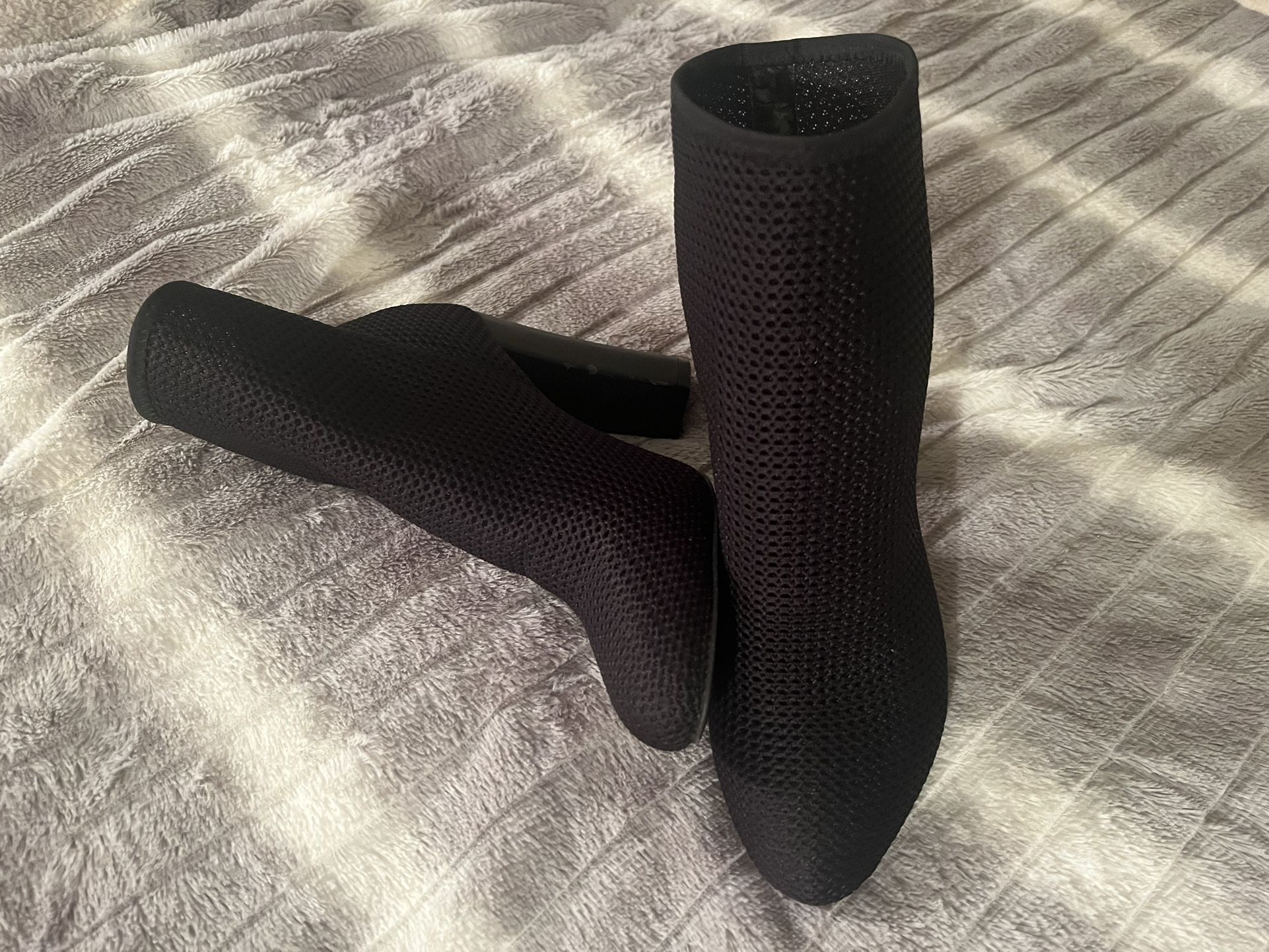 Black short boots for woman size 6.5. Genuine leather insole. Man made material on the outside. Please see last three pictures for wore out details. T